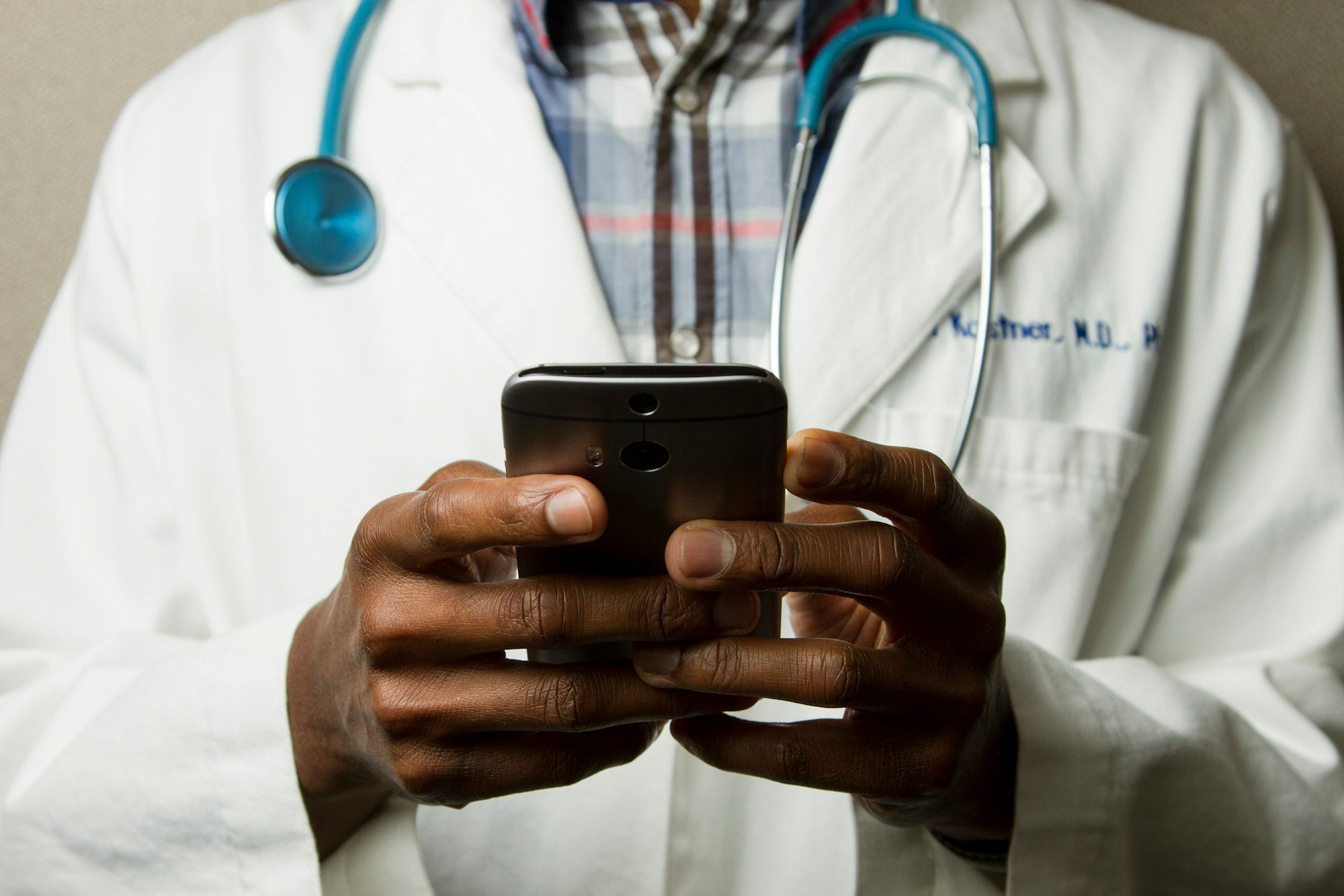 Clinician reviewing patient records on a tablet